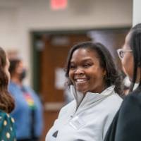 Attendees mingling prior to event start 24